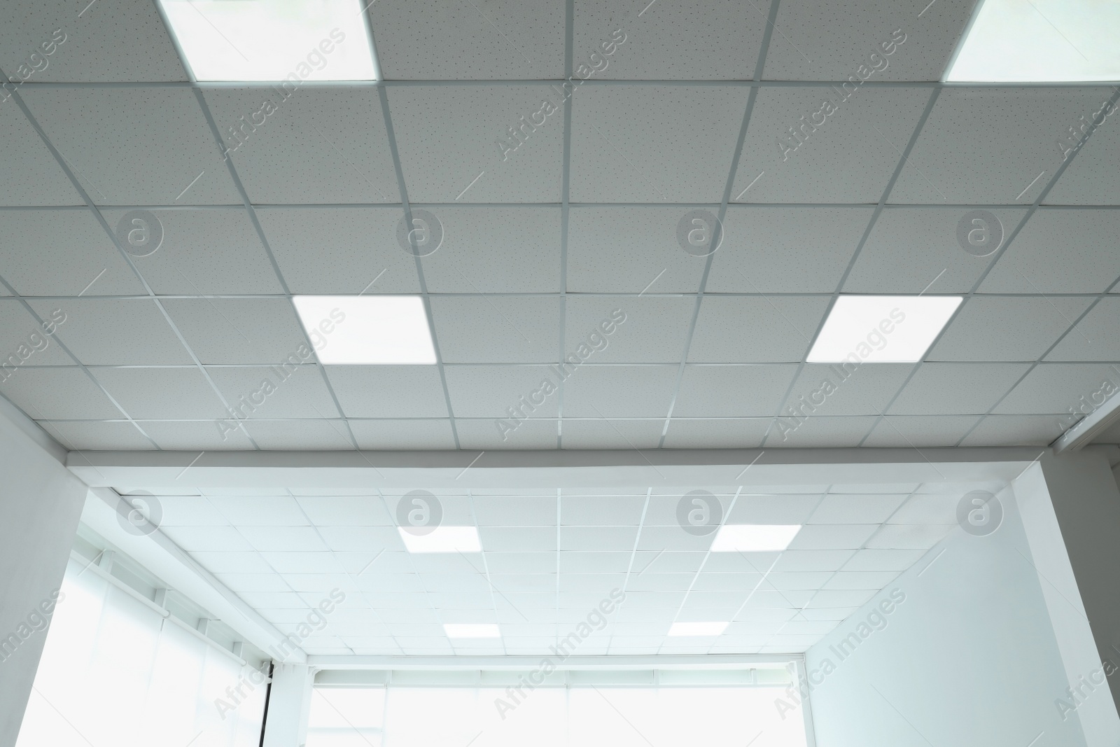 Photo of White ceiling in office room. Interior design