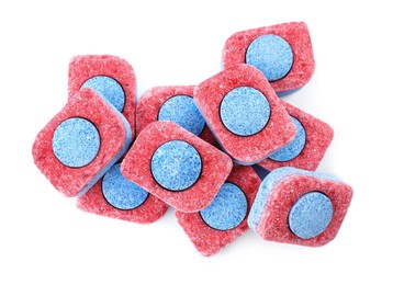 Photo of Pile of dishwasher detergent tablets on white background, top view