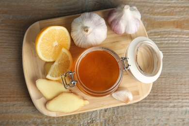 Cold remedies on wooden table, top view. Sore throat treatment