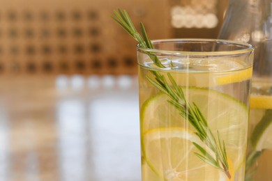 Photo of Summer refreshing lemonade on light table in cafe, closeup. Space for text