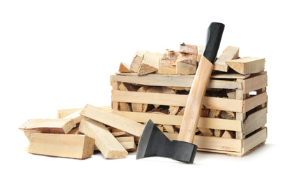 Photo of Axe and cut firewood on white background