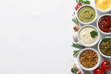 Photo of Composition with different sauces and ingredients on white background, flat lay. Space for text