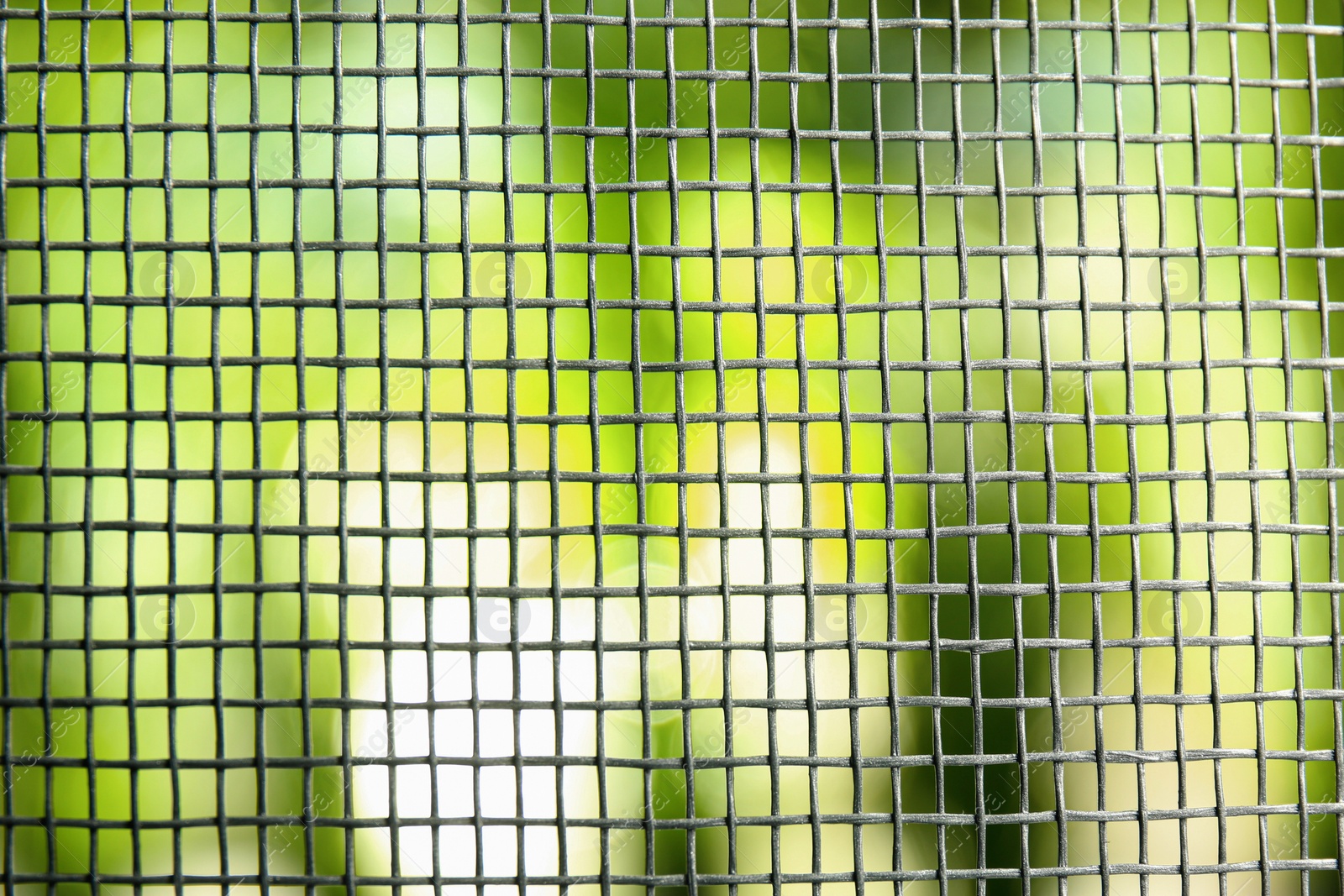 Photo of Insect screen for window against blurred background, closeup