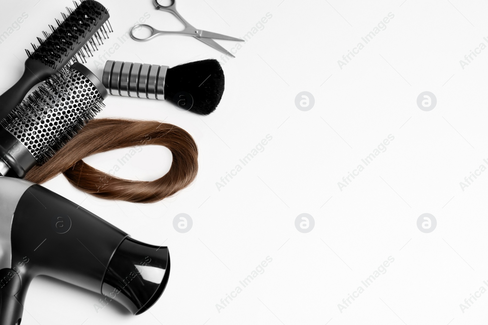 Photo of Professional hairdresser tools on white background