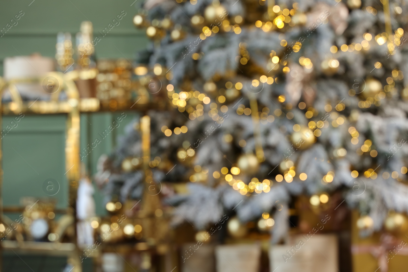 Photo of Blurred view of stylish room interior with Christmas tree and festive decor