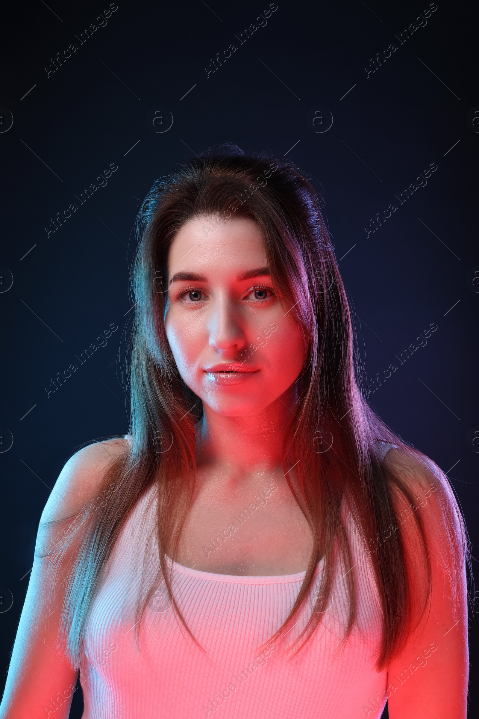 Photo of Portrait of beautiful young woman on color background