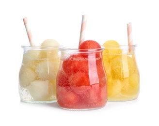 Photo of Glass jars of melon and watermelon ball cocktails on white background