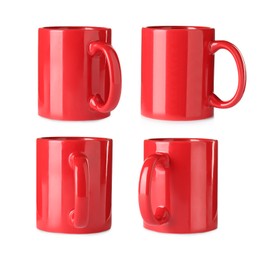 Set with red ceramic mugs on white background 