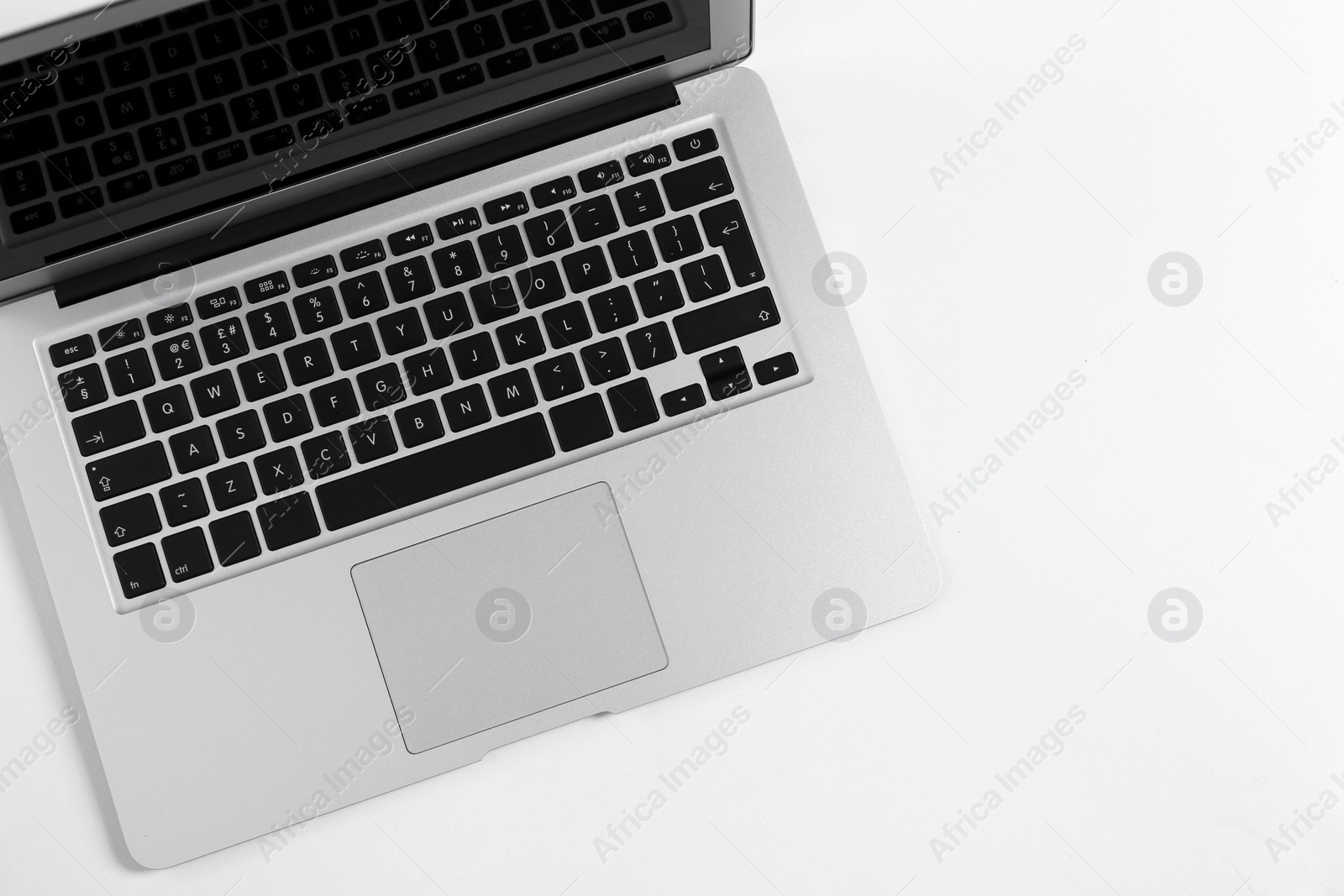 Photo of Modern laptop on light background, top view