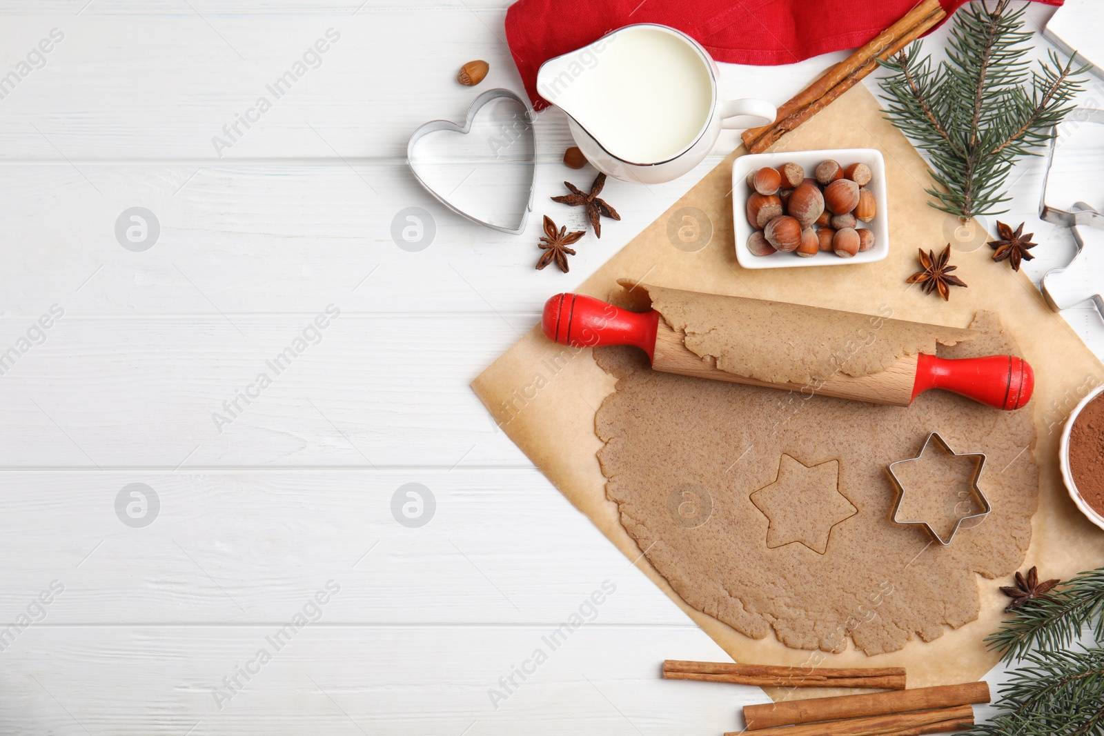 Photo of Homemade Christmas cookies. Flat lay composition with dough on white wooden table, space for text