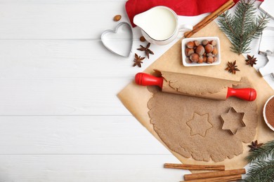 Homemade Christmas cookies. Flat lay composition with dough on white wooden table, space for text