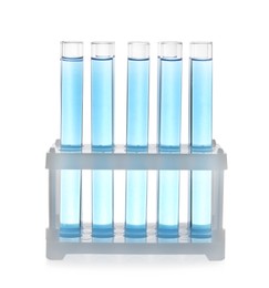 Photo of Test tubes with light blue liquid in rack isolated on white