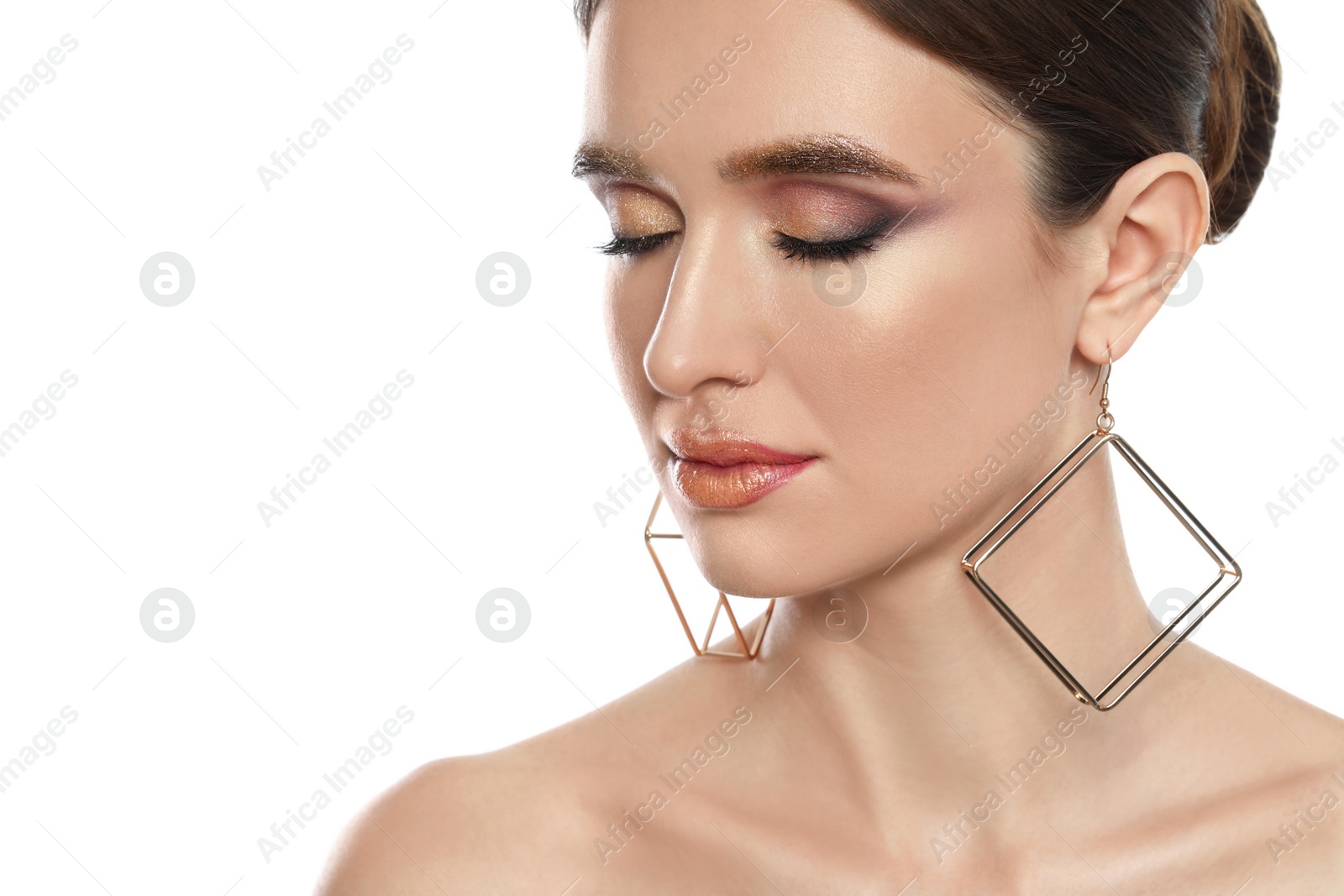 Photo of Beautiful young woman with glitter makeup on white background