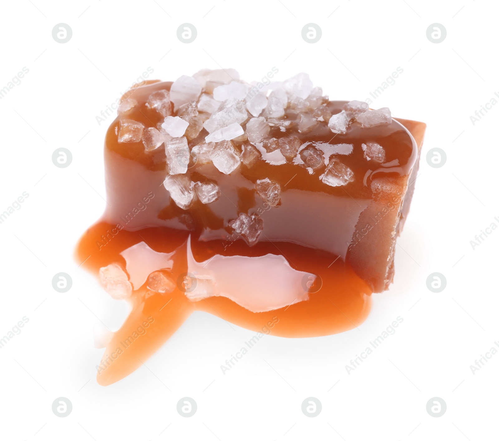 Photo of Delicious salted caramel with sauce on white background