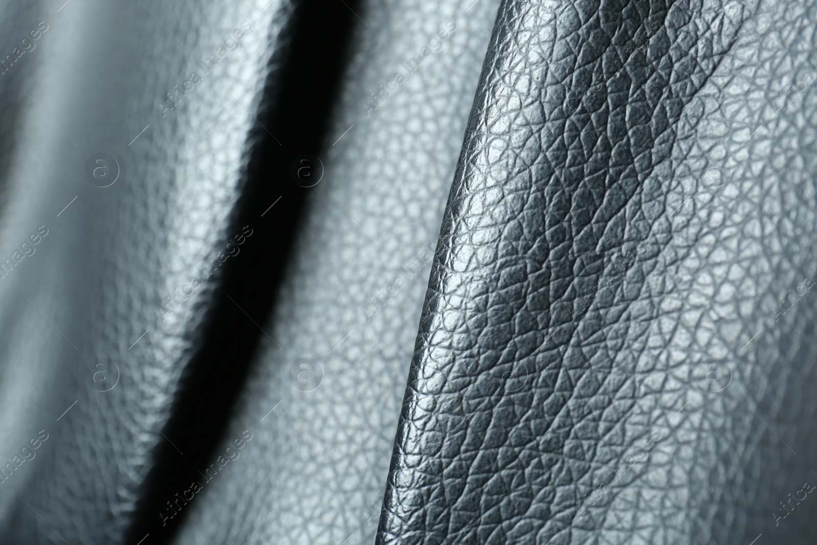 Photo of Black natural leather as background, closeup view