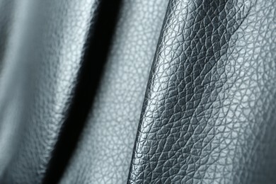 Black natural leather as background, closeup view