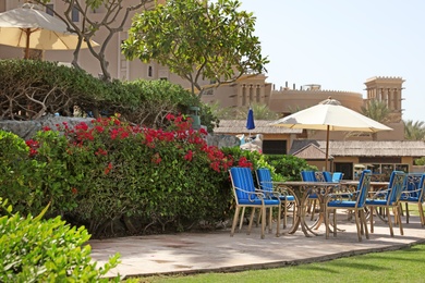 Outdoor cafe at tropical resort on sunny day