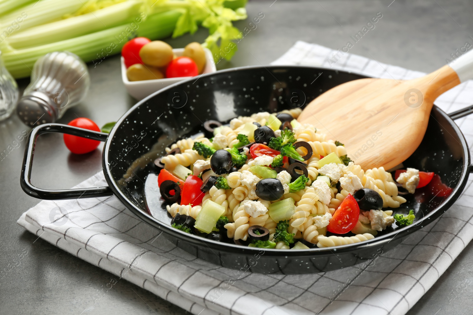 Photo of Tasty pasta with vegetables and  cheese in dish