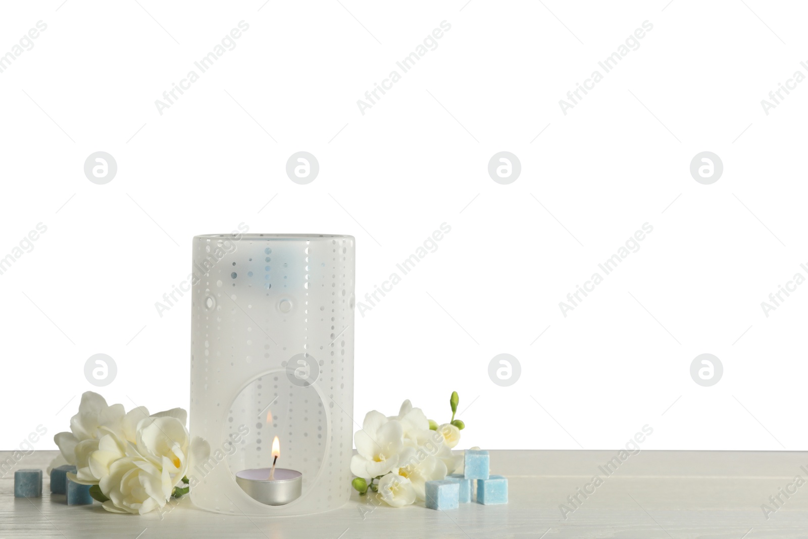 Photo of Composition with aroma lamp on white table against light grey background, space for text