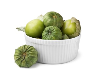 Photo of Bowl of fresh green tomatillos with husk isolated on white