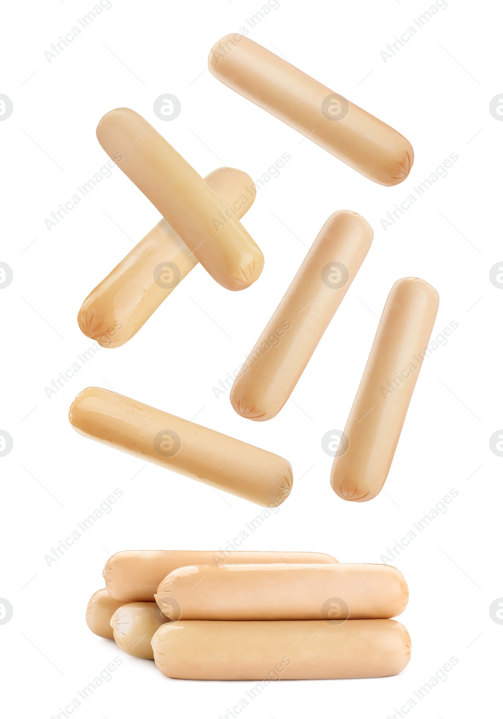 Image of Fresh raw sausages falling on white background