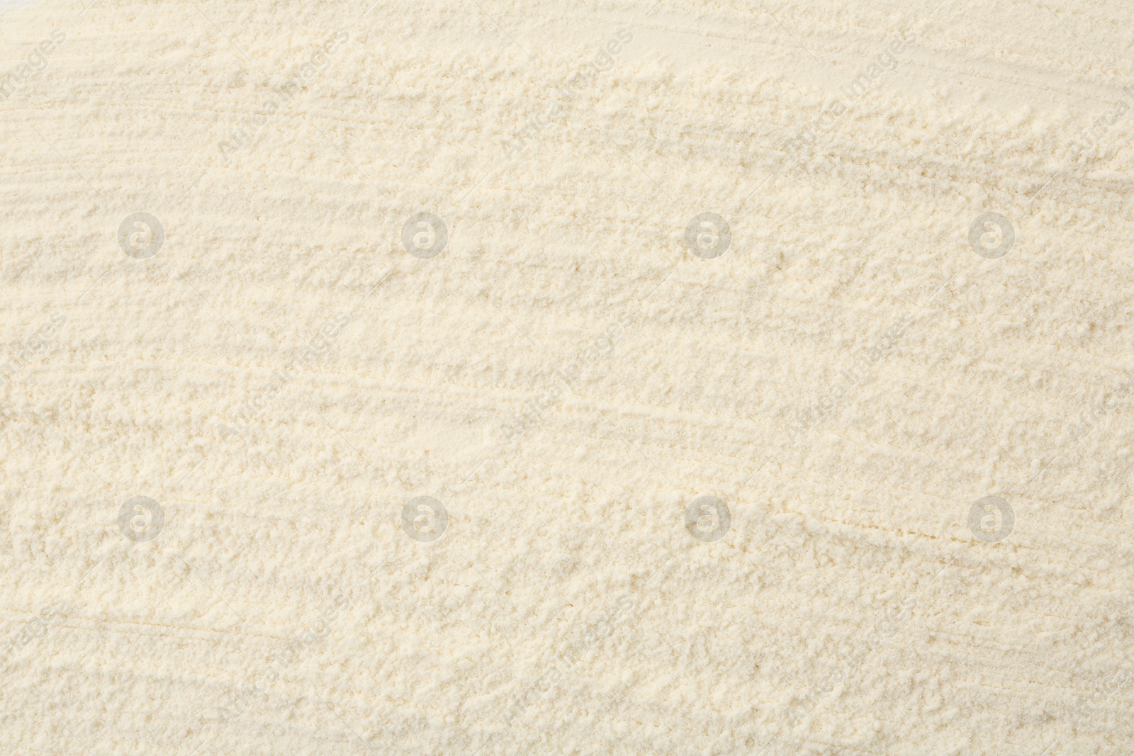 Photo of Texture of baking powder as background, top view