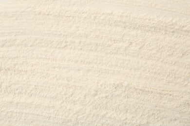 Photo of Texture of baking powder as background, top view