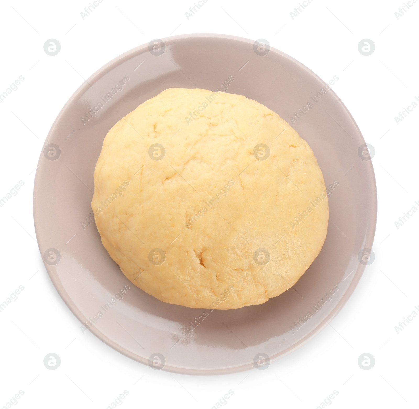 Photo of Plate with raw dough on white background, top view