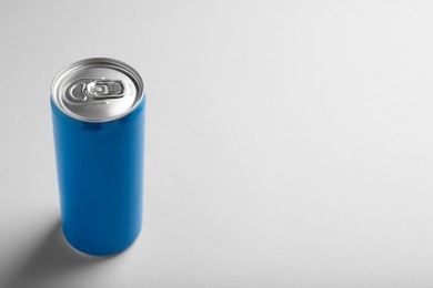 Blue can of energy drink on white background. Space for text
