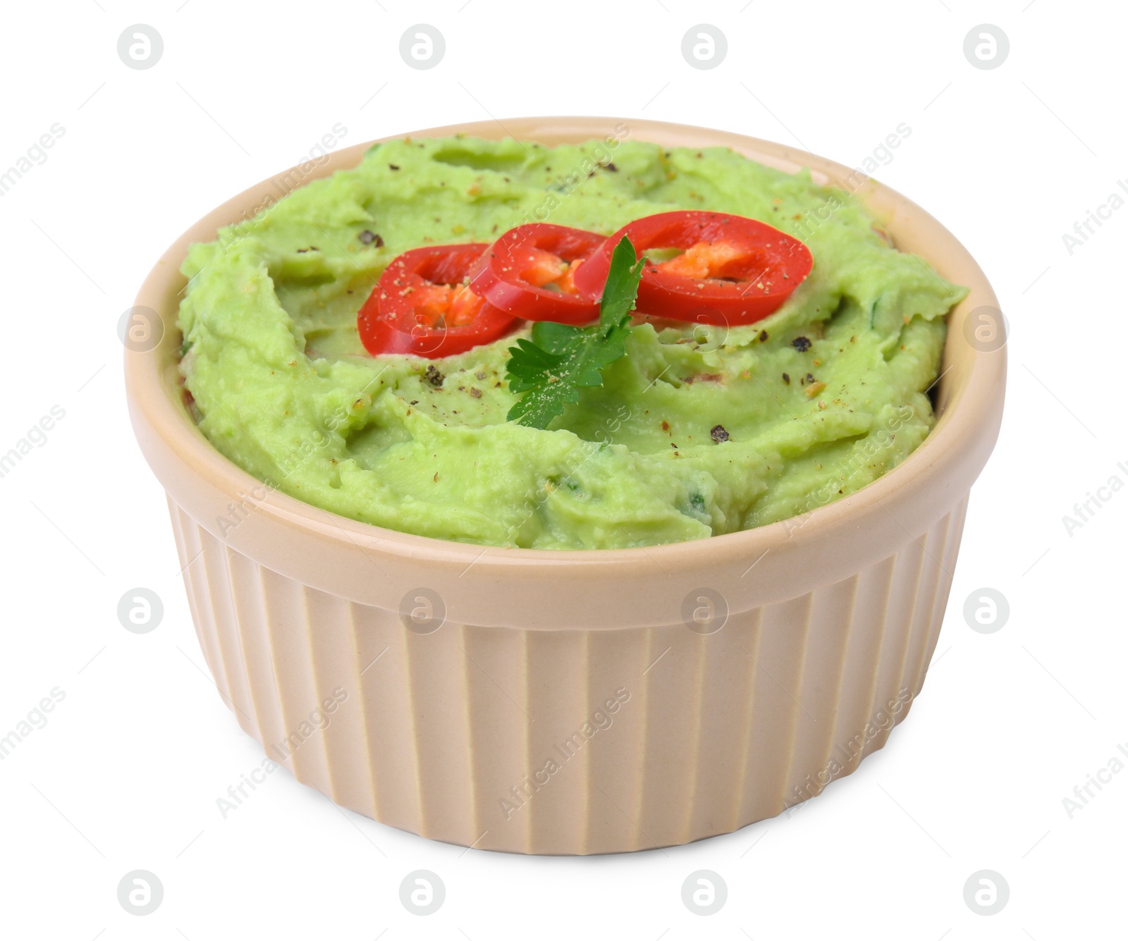 Photo of Bowl of delicious guacamole with chili pepper isolated on white