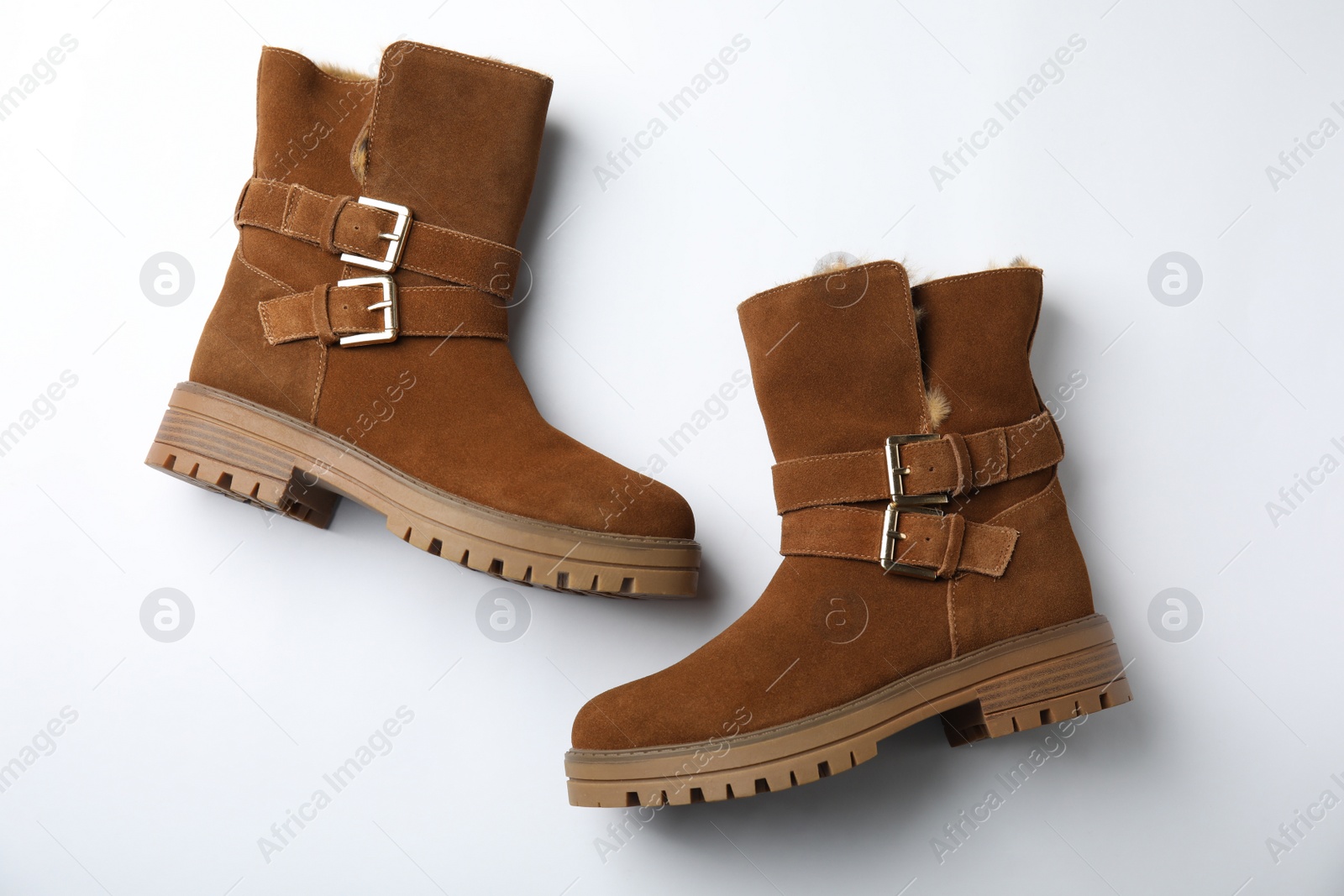 Photo of Stylish brown boots on white background, top view