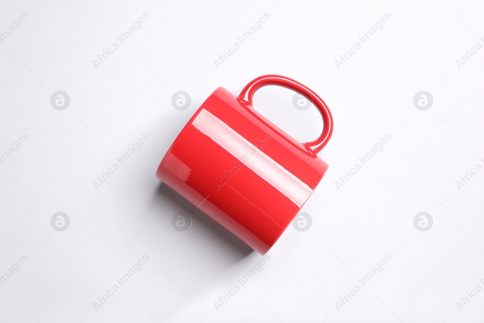 One red ceramic mug on light background, top view Photo of One red ceramic mug on light background, top view