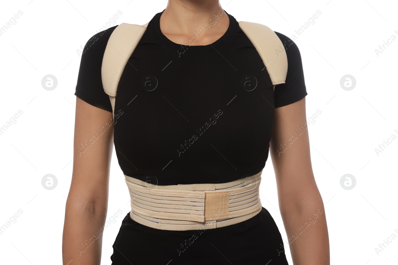 Photo of Closeup view of woman with orthopedic corset on white background