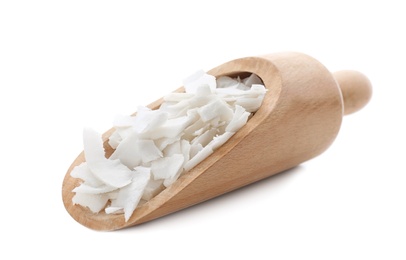 Photo of Wooden scoop with coconut flakes on white background