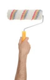 Photo of Man holding paint roller brush on white background, closeup