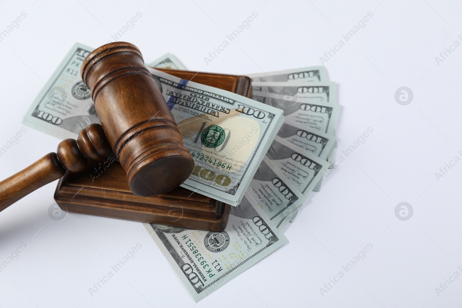 Photo of Judge's gavel and money on white background. Space for text