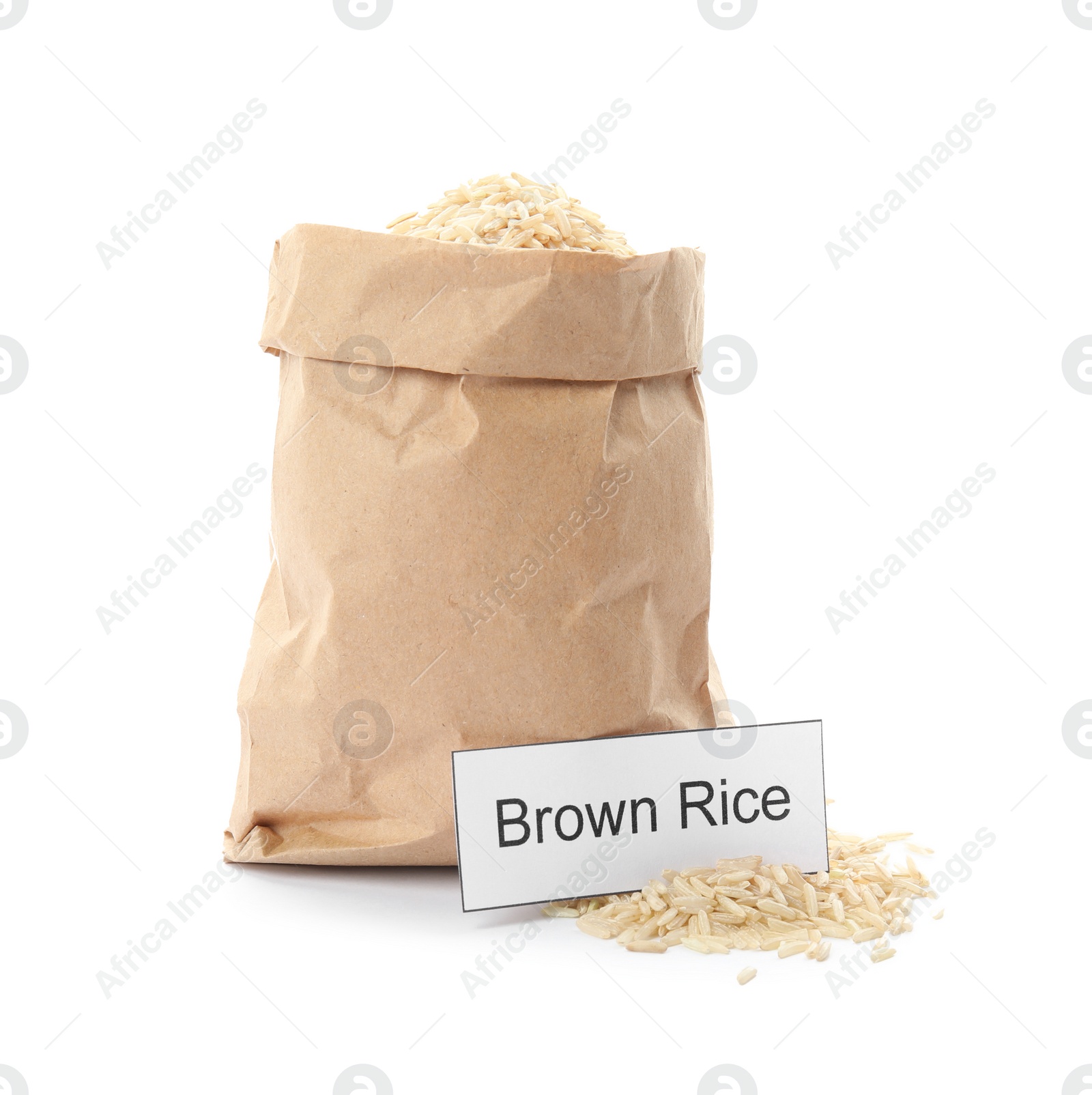 Photo of Paper bag with uncooked brown rice and card on white background