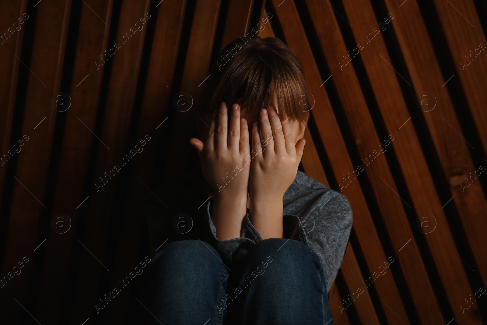 Image of Claustrophobia. Stressed little girl feeling in closed space and crying