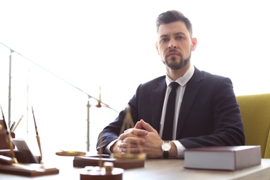 Photo of Male lawyer working in office