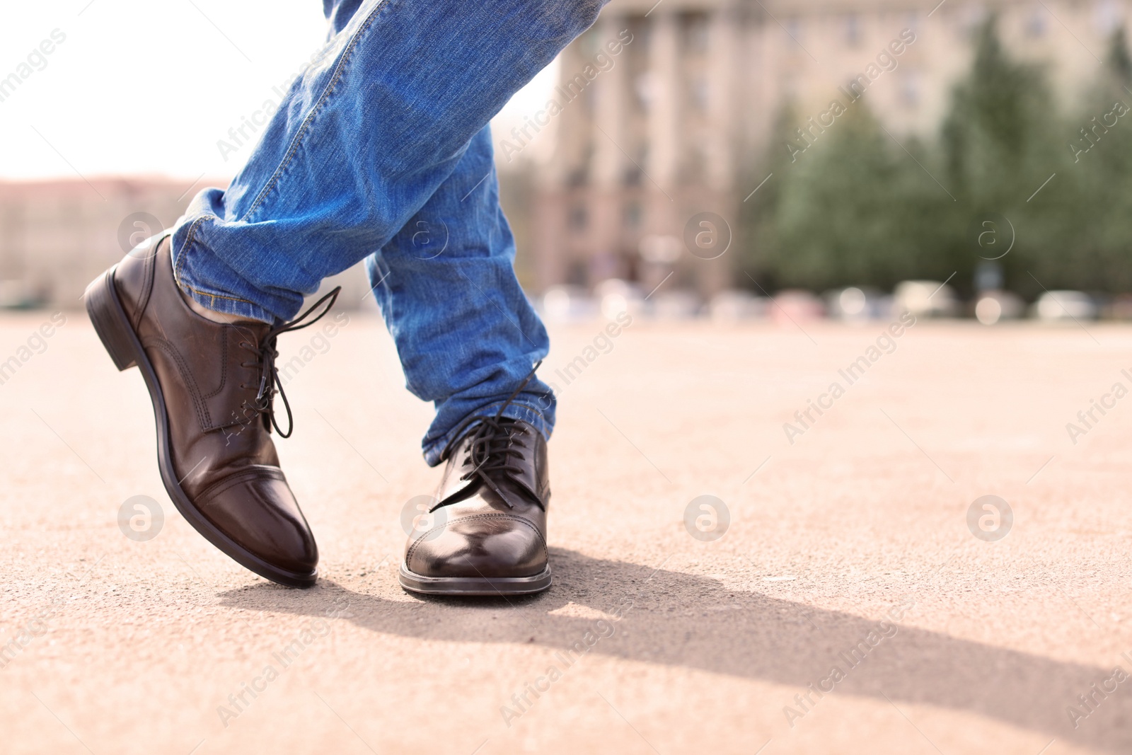 Photo of Man in elegant leather shoes outdoors, closeup