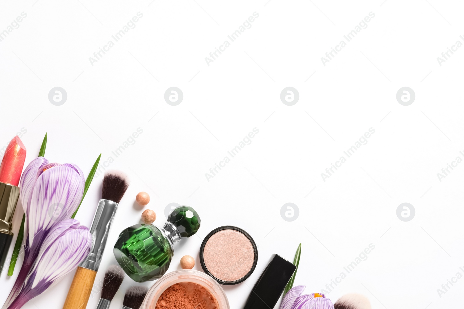 Photo of Different makeup products and flowers on white background, top view