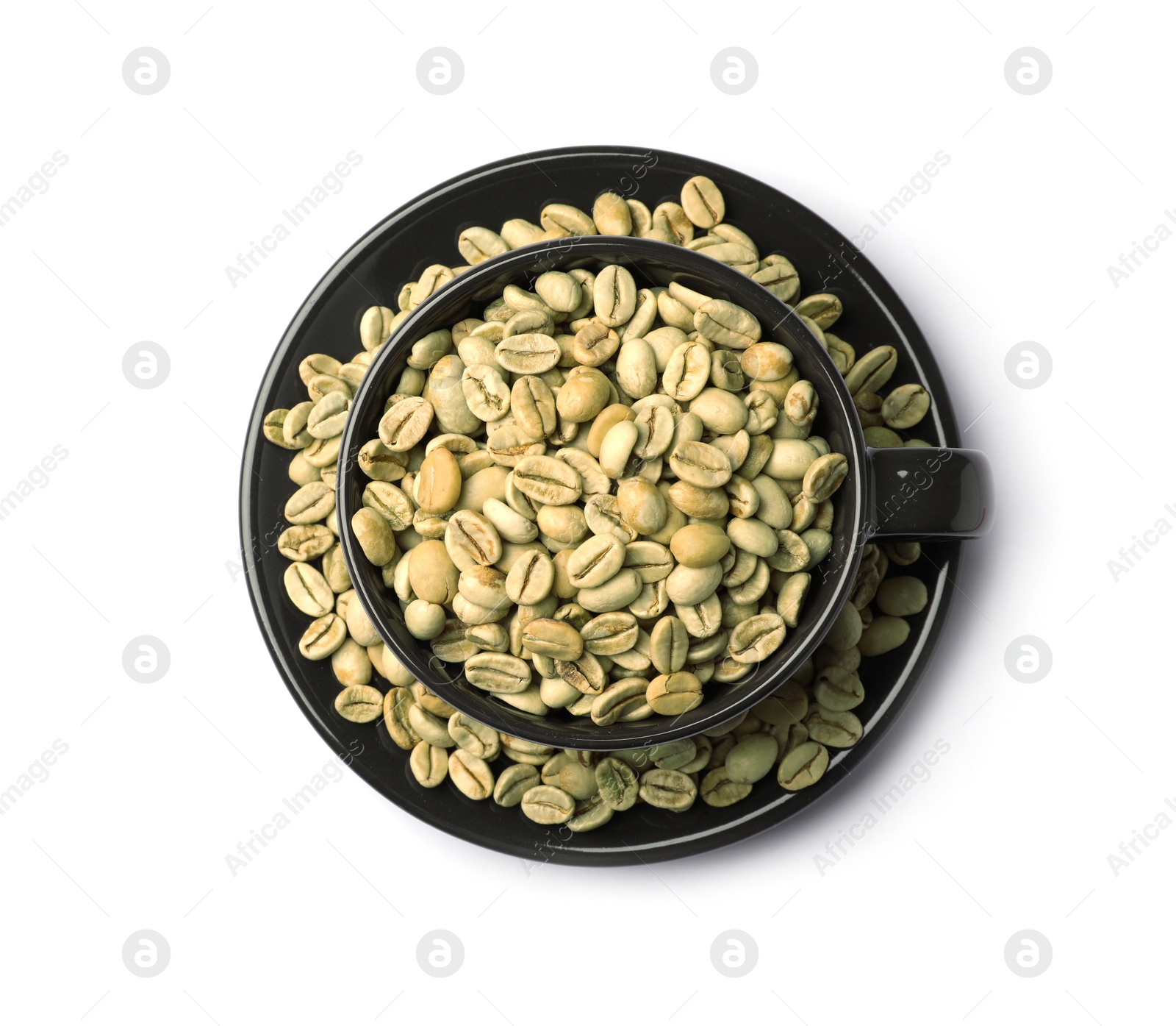 Photo of Cup and plate with green coffee beans on white background, top view