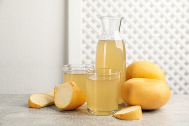 Freshly made turnip juice on light grey table