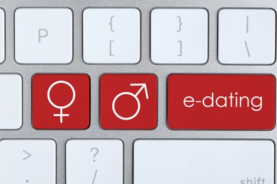 Image of Love buttons on laptop keyboard, top view. Online dating site
