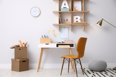 Photo of Stylish room interior with modern comfortable workplace