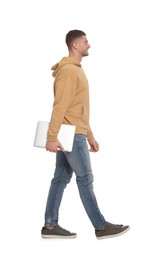Photo of Man with laptop walking on white background