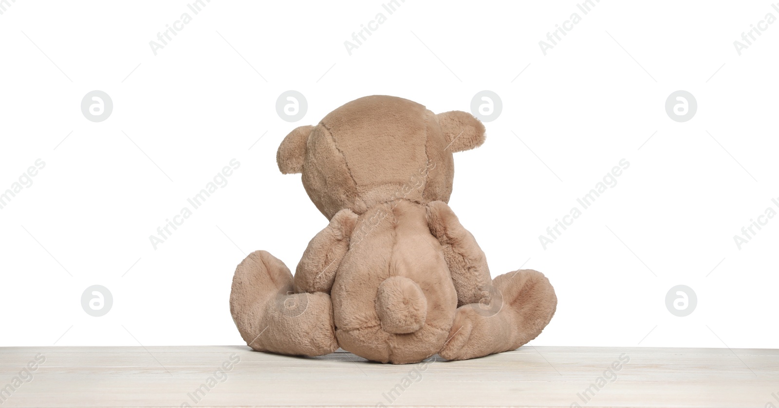 Photo of Cute teddy bear isolated on white, back view