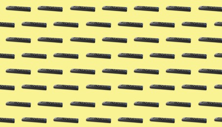 Remote controller pattern on light yellow background. Collage design