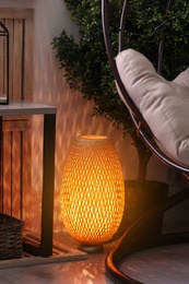 Photo of Stylish lamp in modern living room. Interior design element