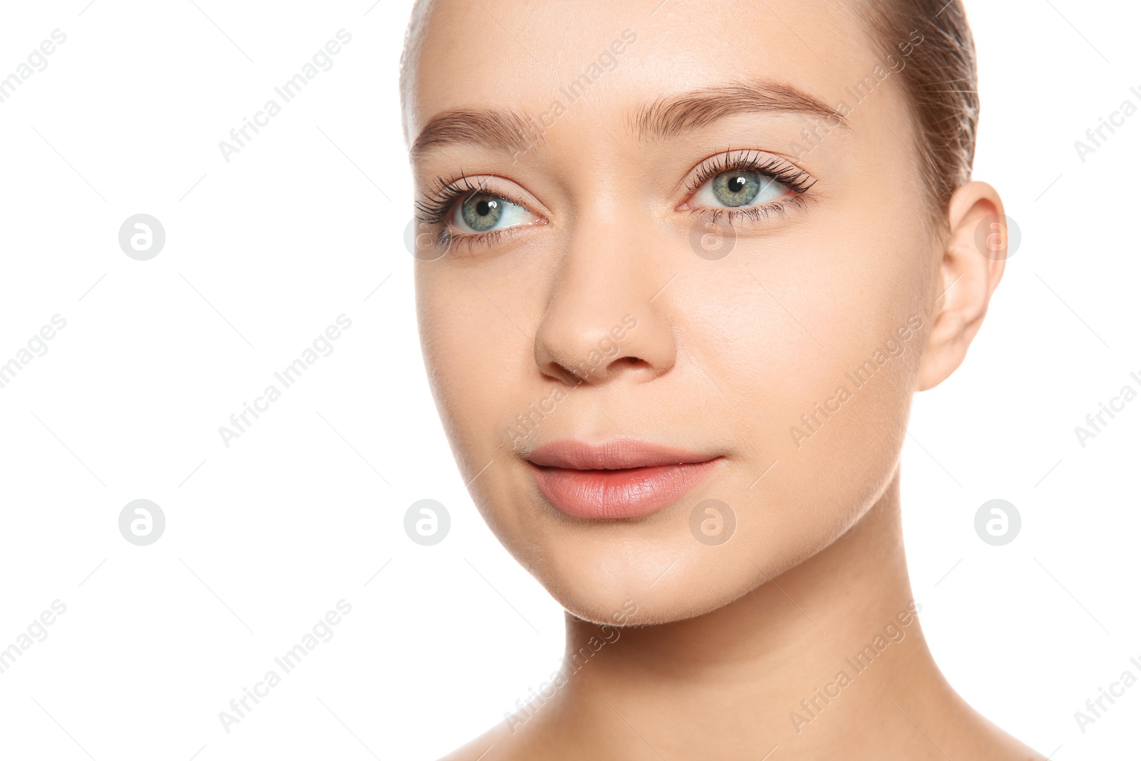 Photo of Portrait of young woman with foundation on her face against white background